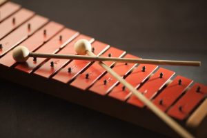 Shallow Focus Photography of Red Xylophone